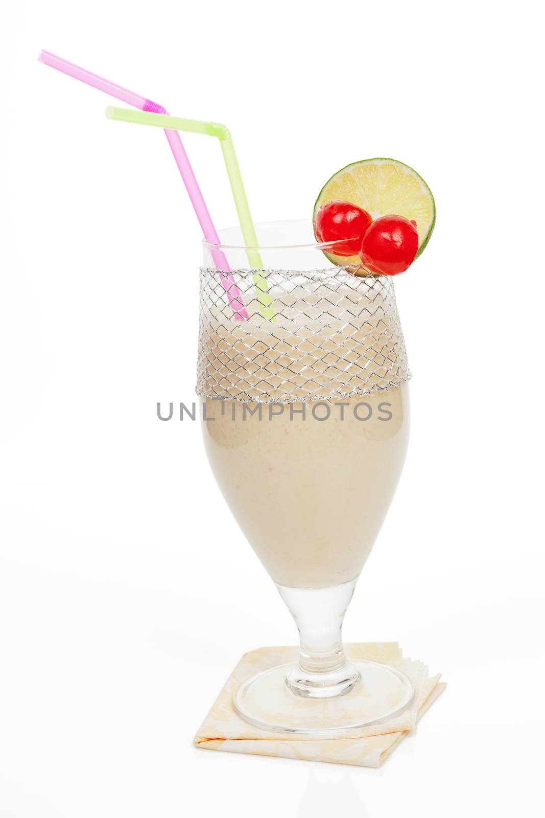 Delicious banana milkshake with cherry and lemon garnish isolated on white background. Healthy summer drinks.