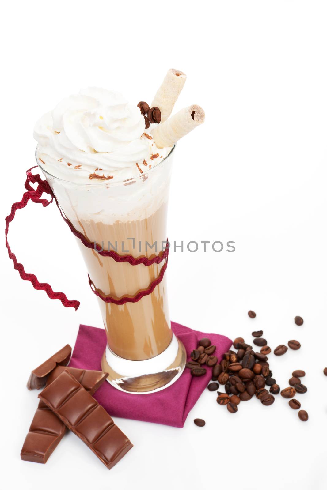 Delicious culinary ice coffee with foam, chocolate bars and coffee beans isolated on white background. Cool summer drinks.