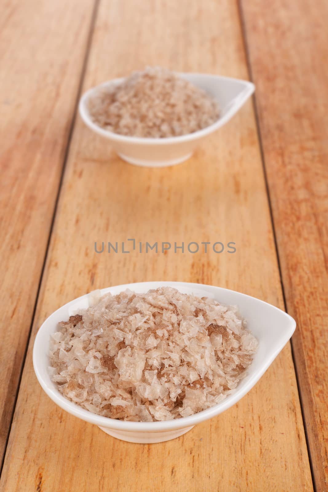 Natural Black Sea salt crystals in white bowl. by eskymaks
