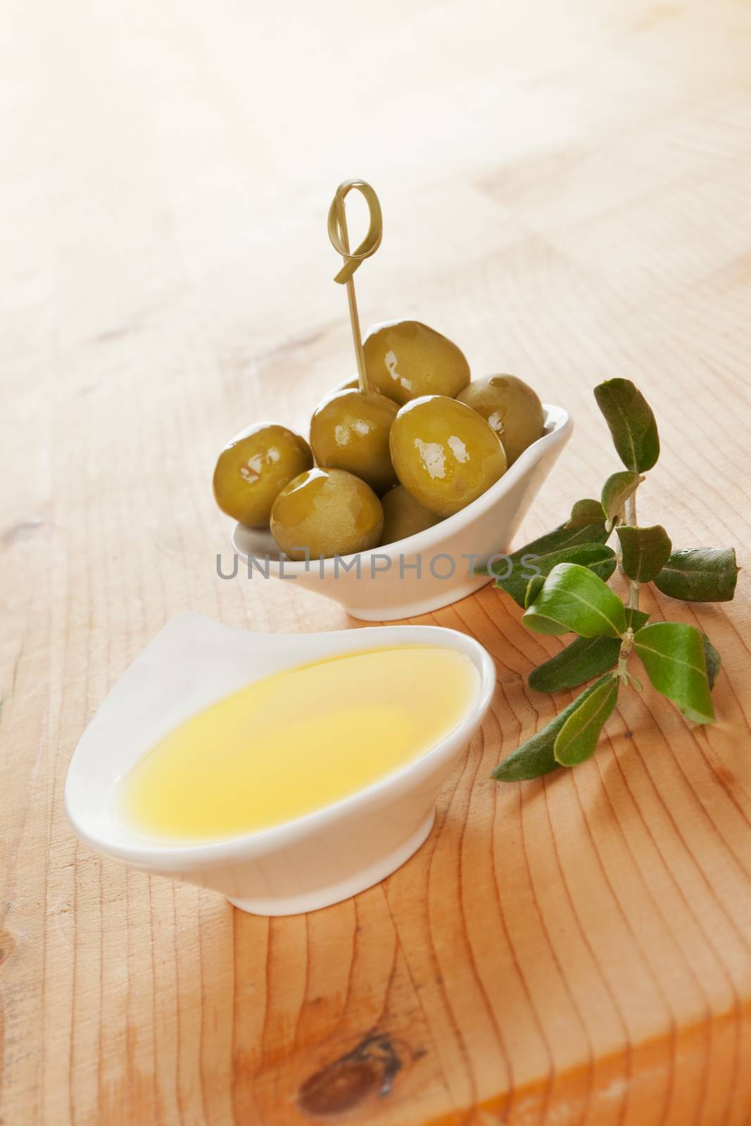 Olive oil wooden background. by eskymaks