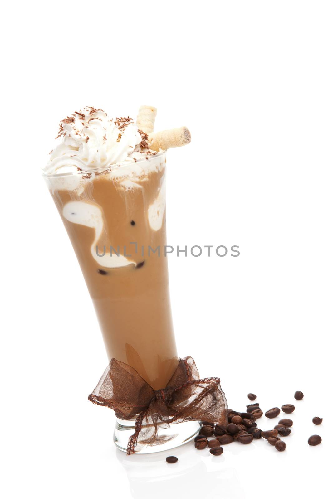 Delicious ice coffee with brown ribbon and coffee beans isolated on white. Refreshing summer drink.