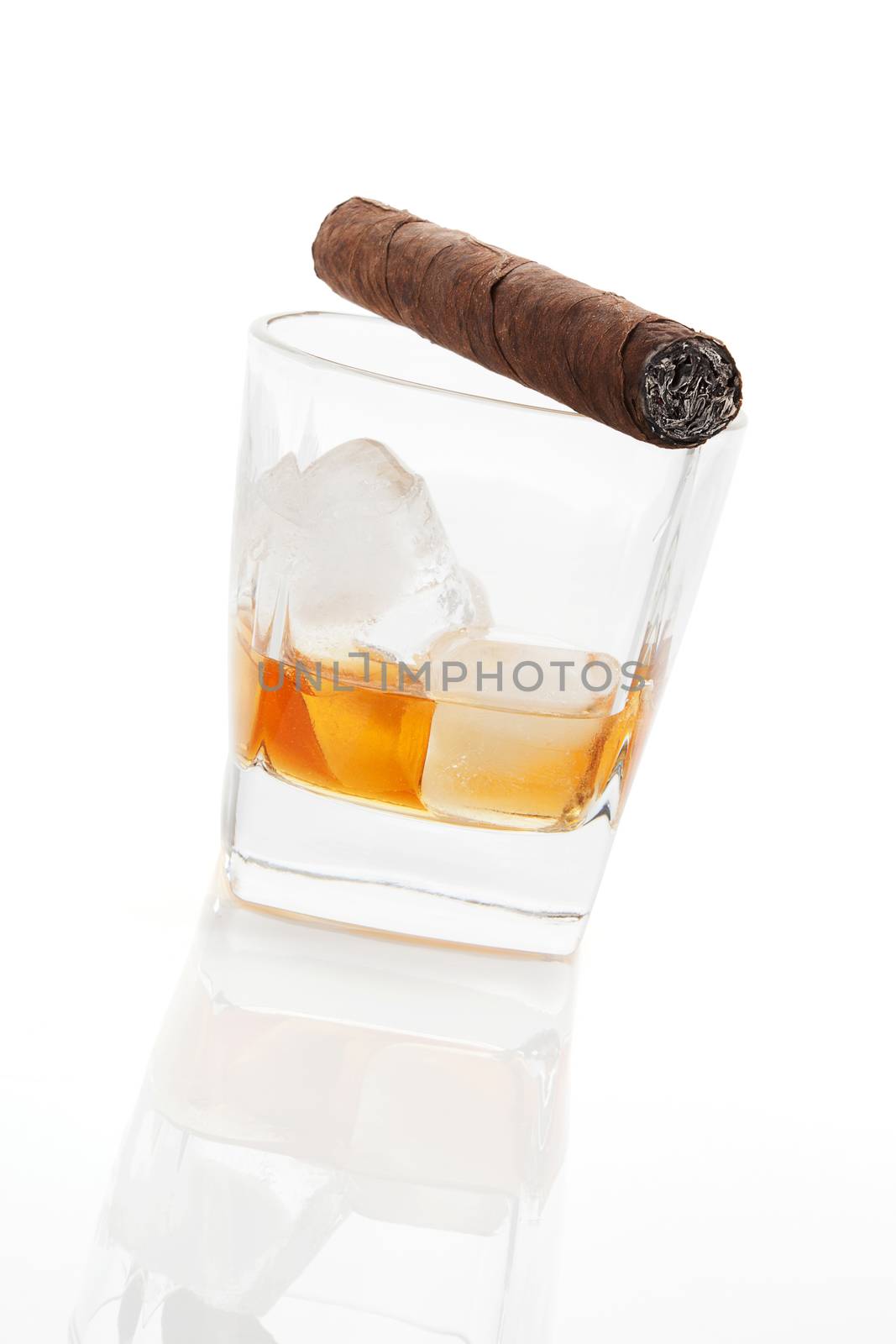 Alcohol and tobacco. Addiction concept. Whiskey and cigar isolated on white background.