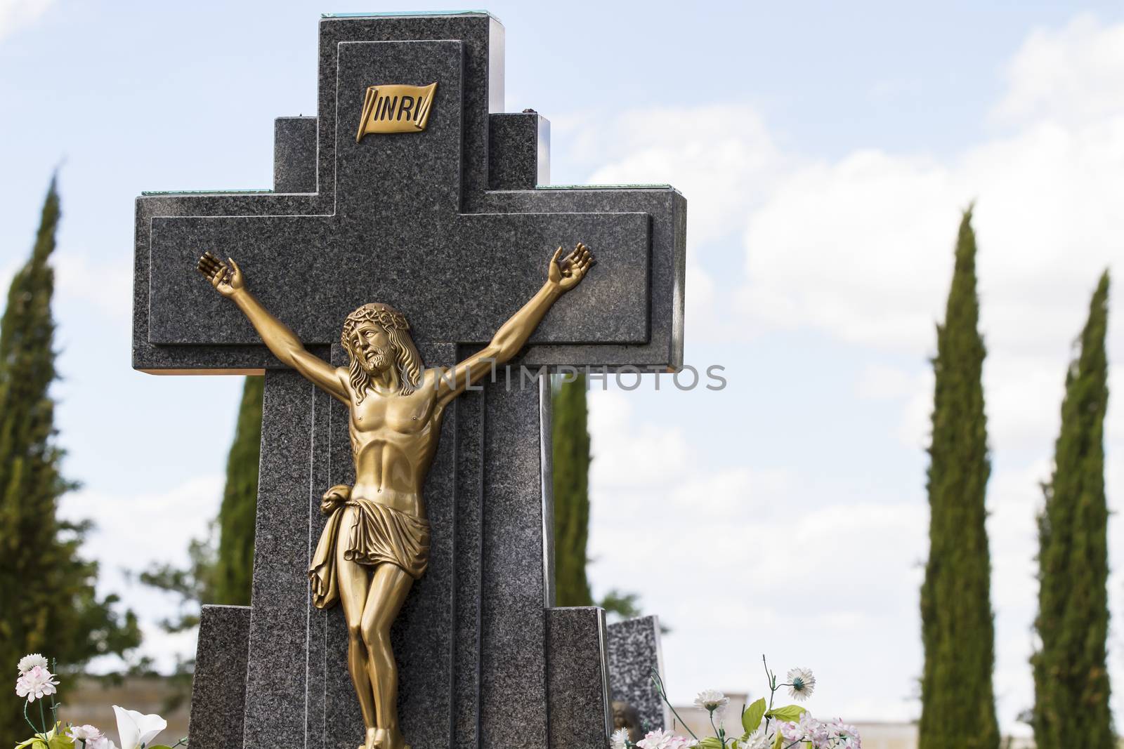 Jesus Christ on the cross in a cemetery by FernandoCortes