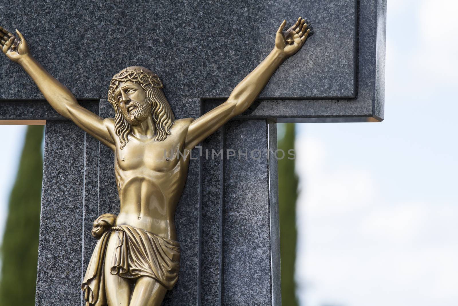Jesus Christ on the cross in a cemetery by FernandoCortes