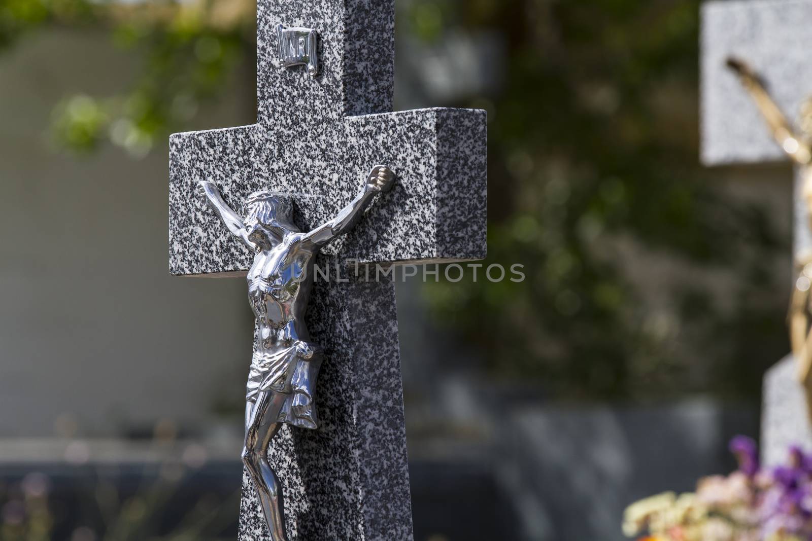 Jesus Christ on the cross in a cemetery by FernandoCortes
