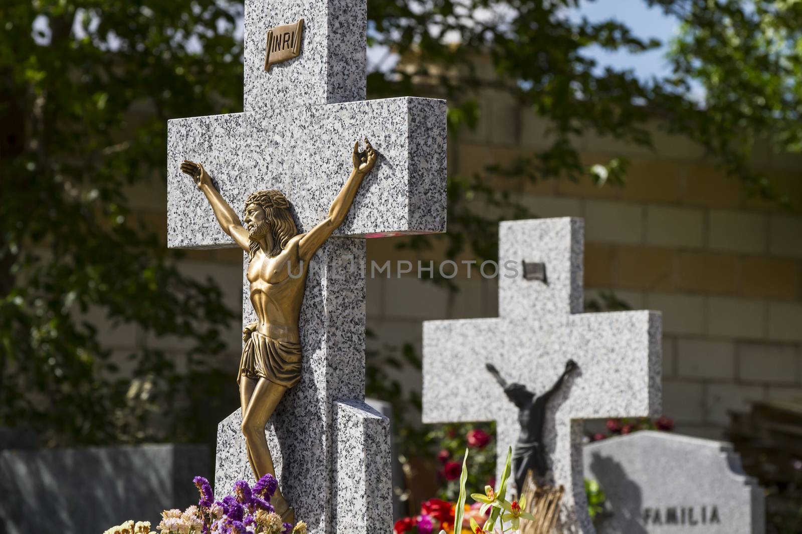 Jesus Christ on the cross in a cemetery by FernandoCortes