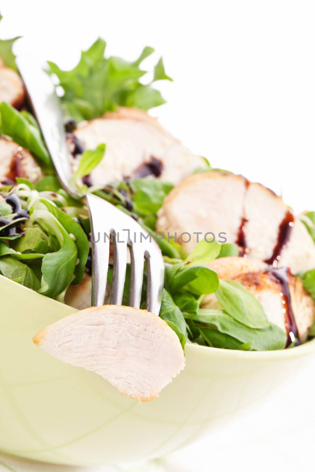 Luxurious fresh corn salad with grilled chicken pieces and balsamico dressing in bowl. Luxurious fresh light summer eating.