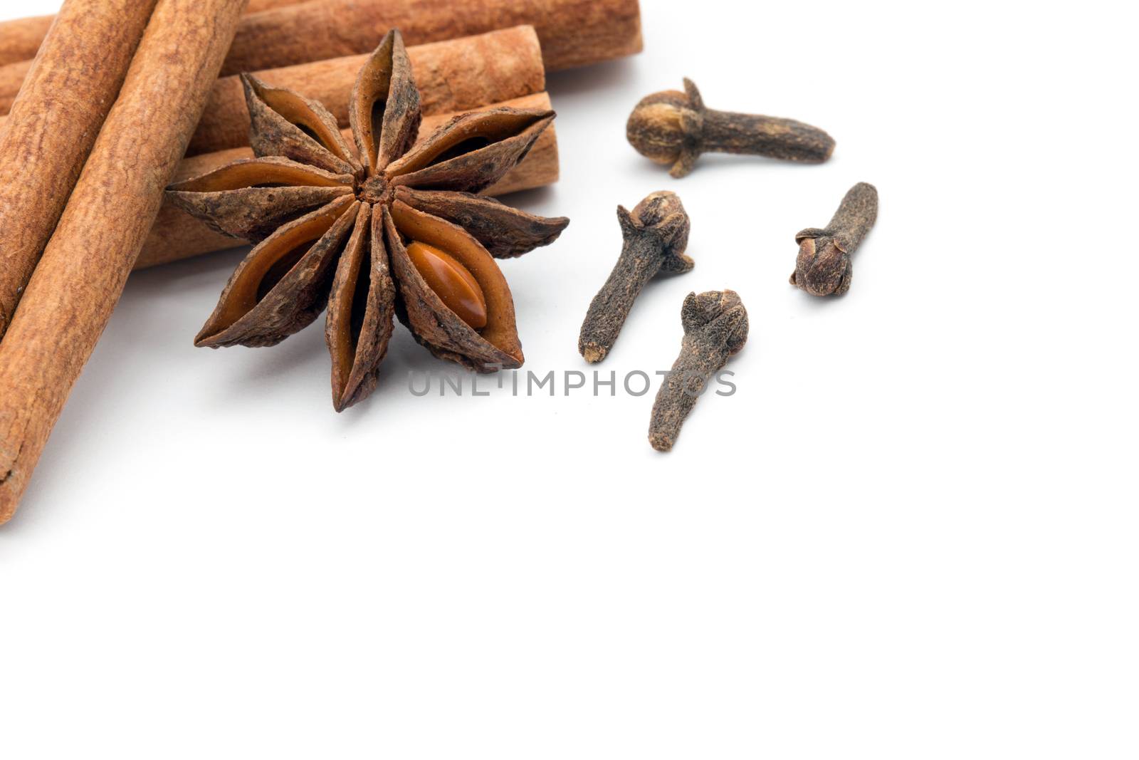 Cloves, anise and cinnamon isolated on white background