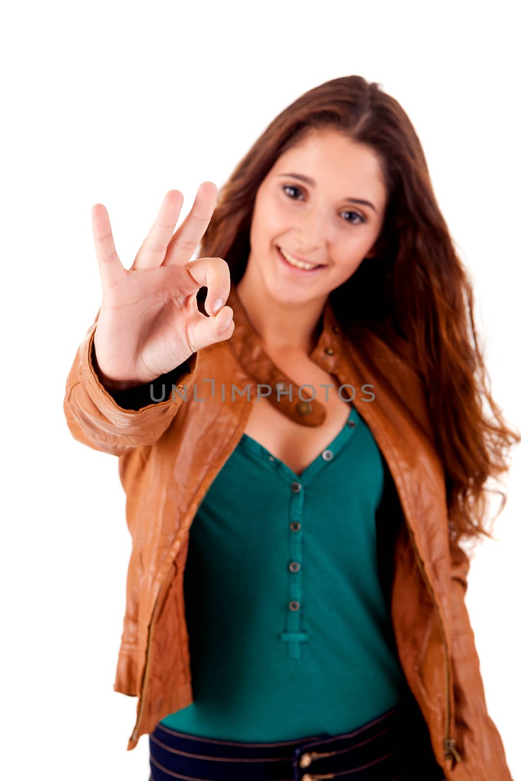 Beautiful young woman doing ok over white background