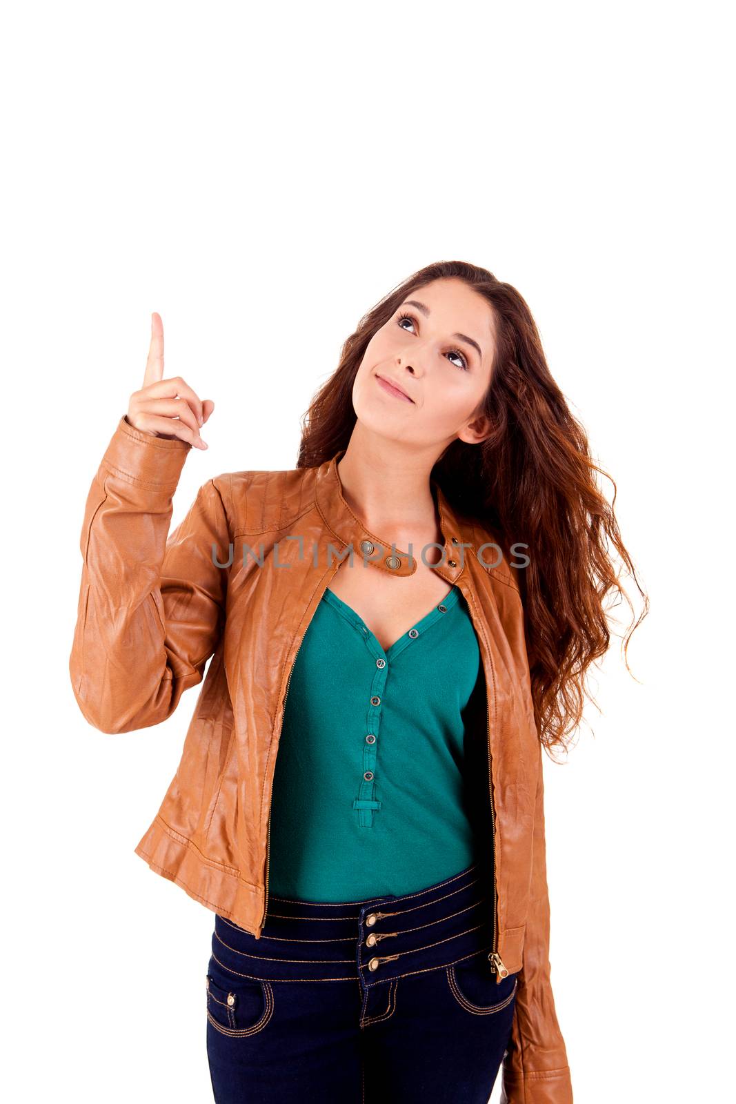 Young beautiful female pointing at copyspace