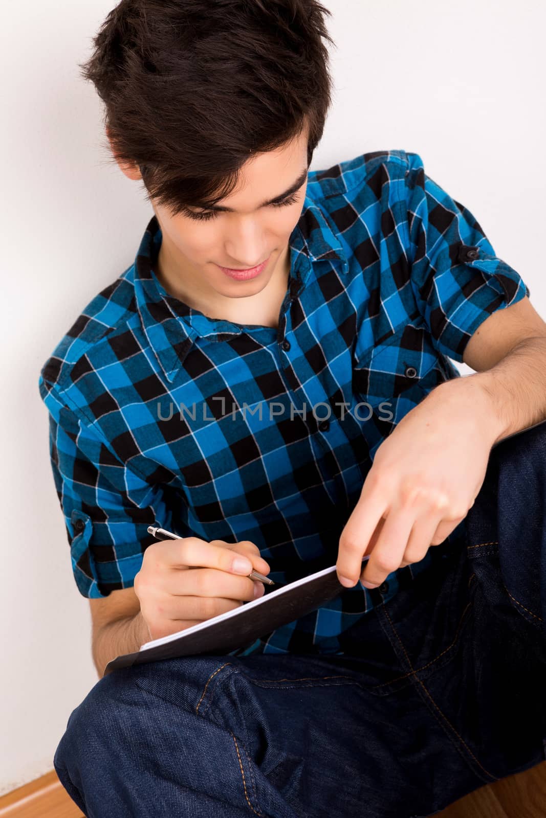 Young man studying at home