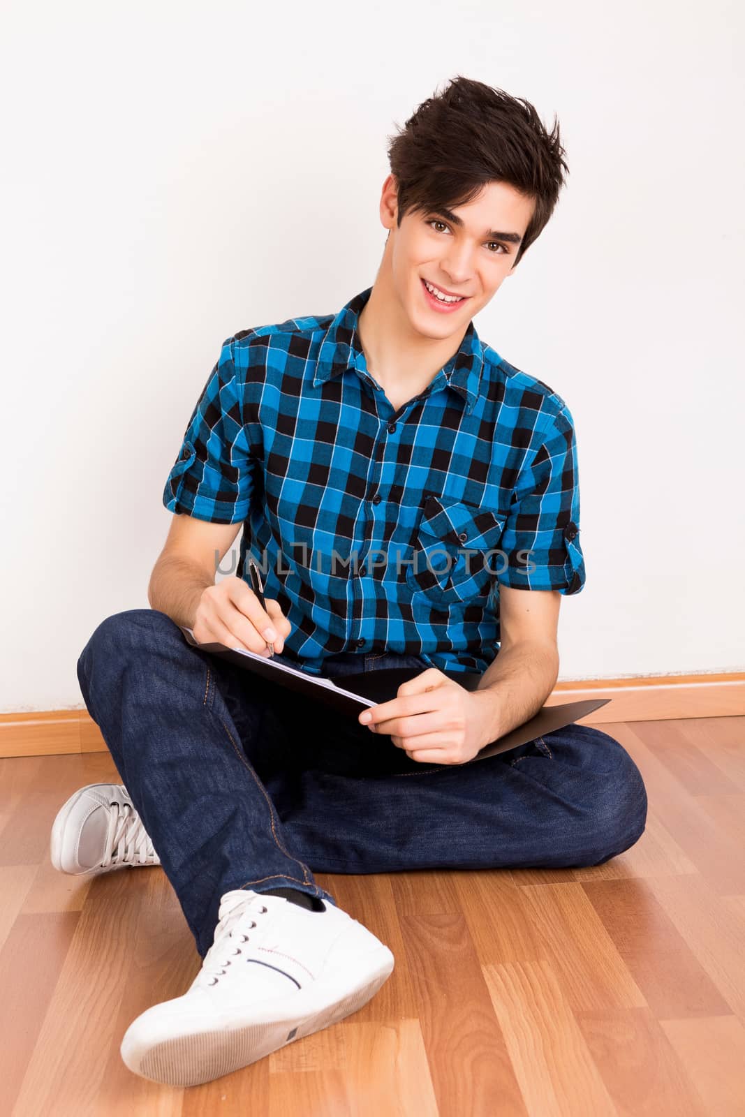 Young man studying at home