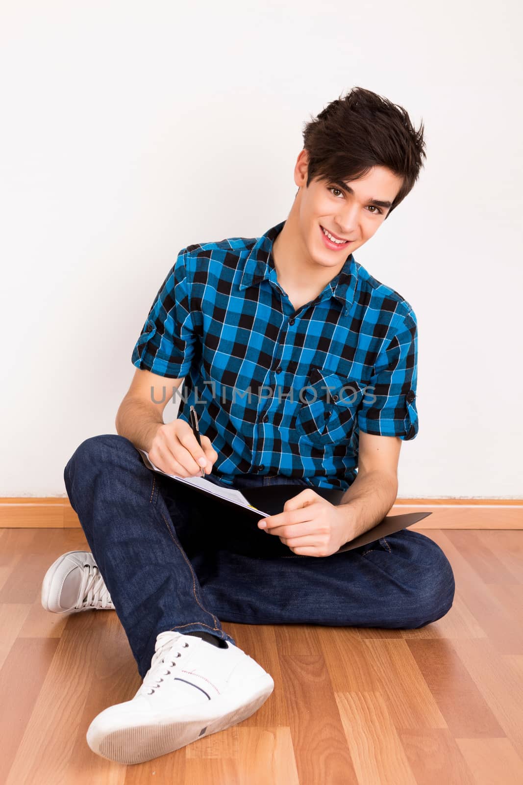 Young man studying at home