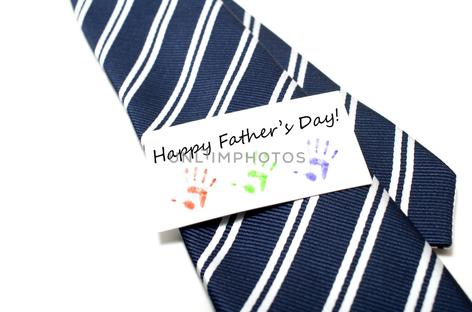 Happy Father's Day with colorful hand prints tag on blue tie ove by daoleduc