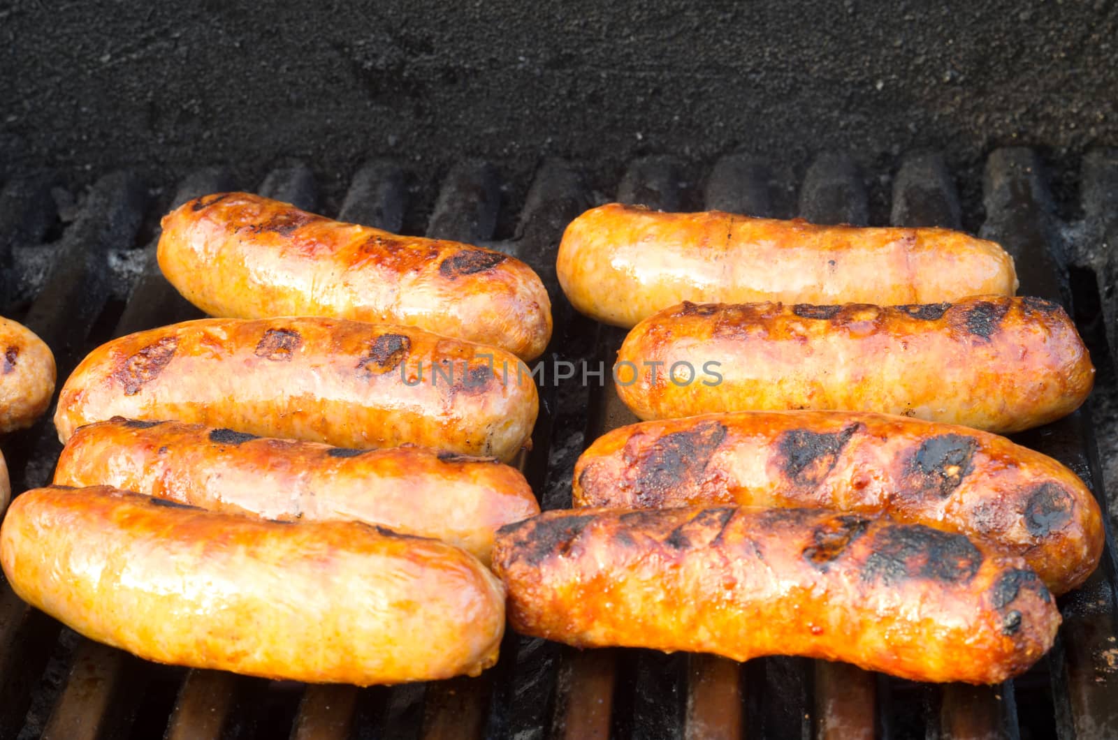 Italian sausages on grill by daoleduc
