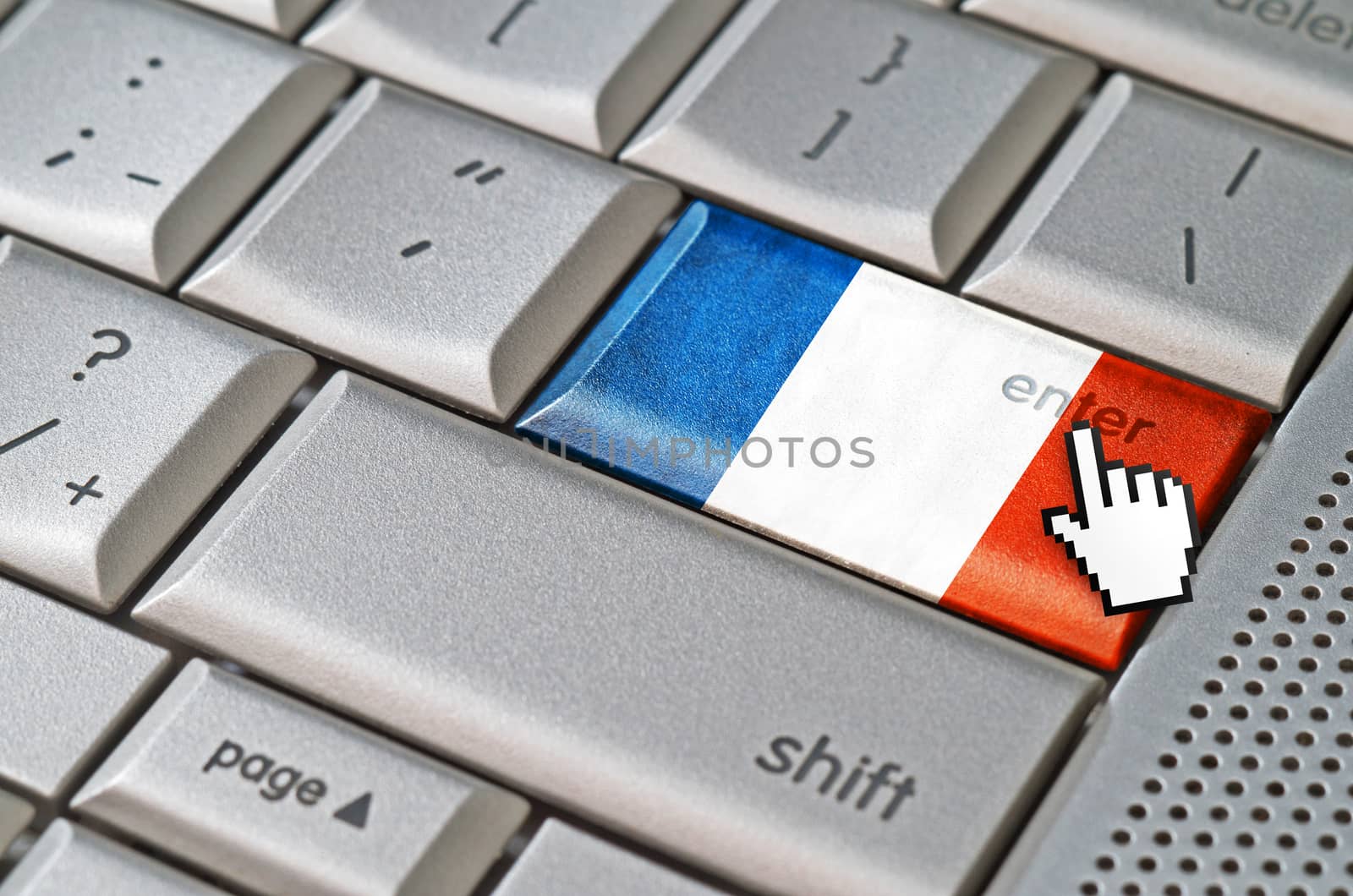 Business concept mouse cursor pressing France enter key on metallic keyboard