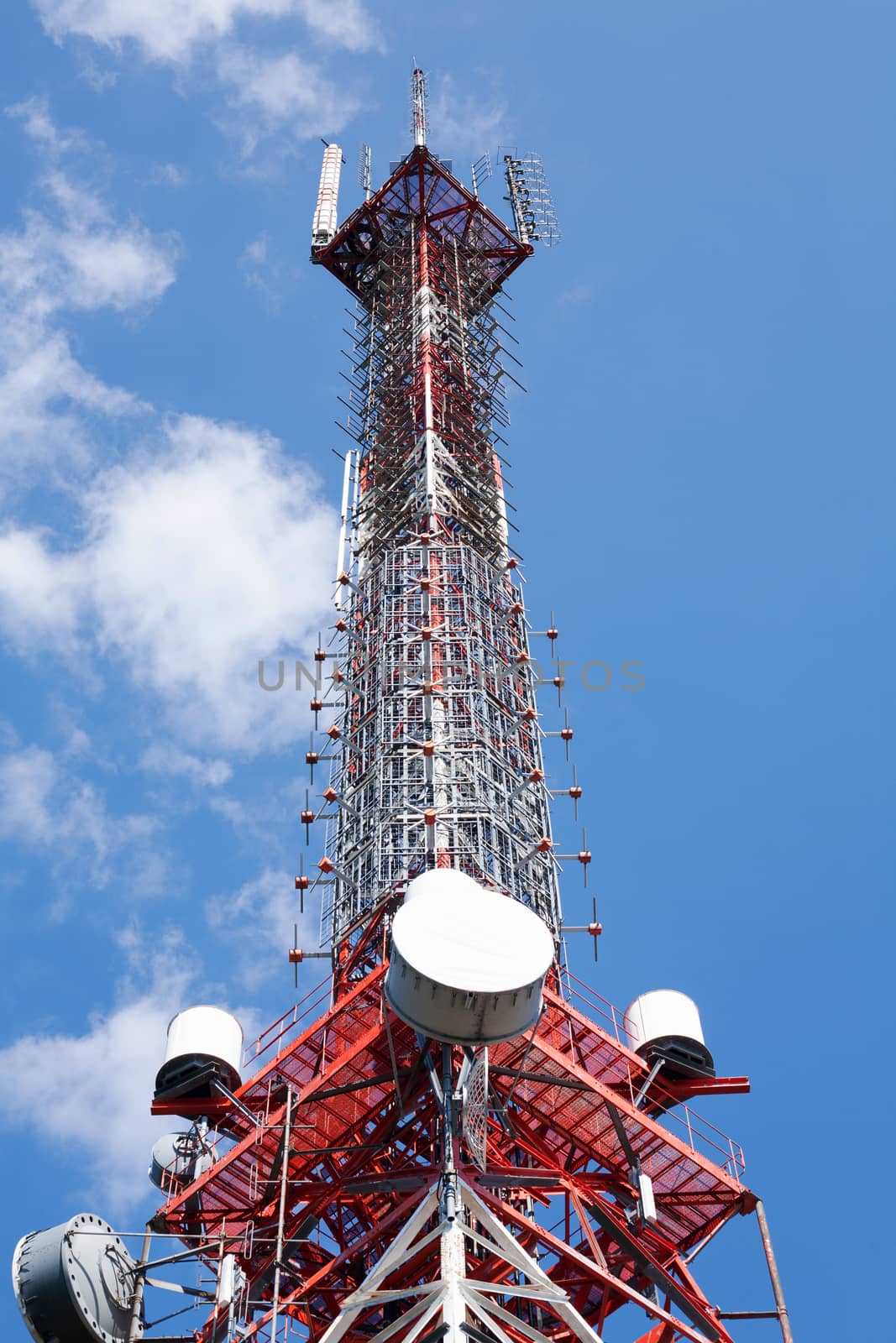 Tall Communication tower during a summer day