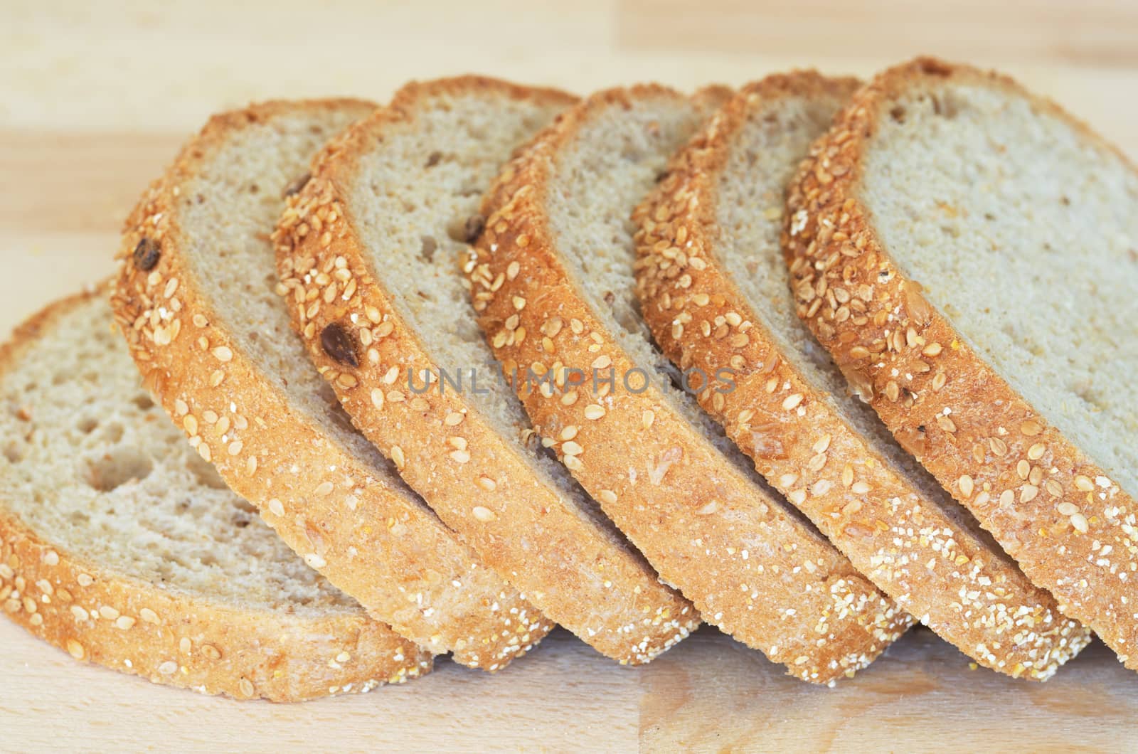 Whole grain sandwich sliced on cutting board