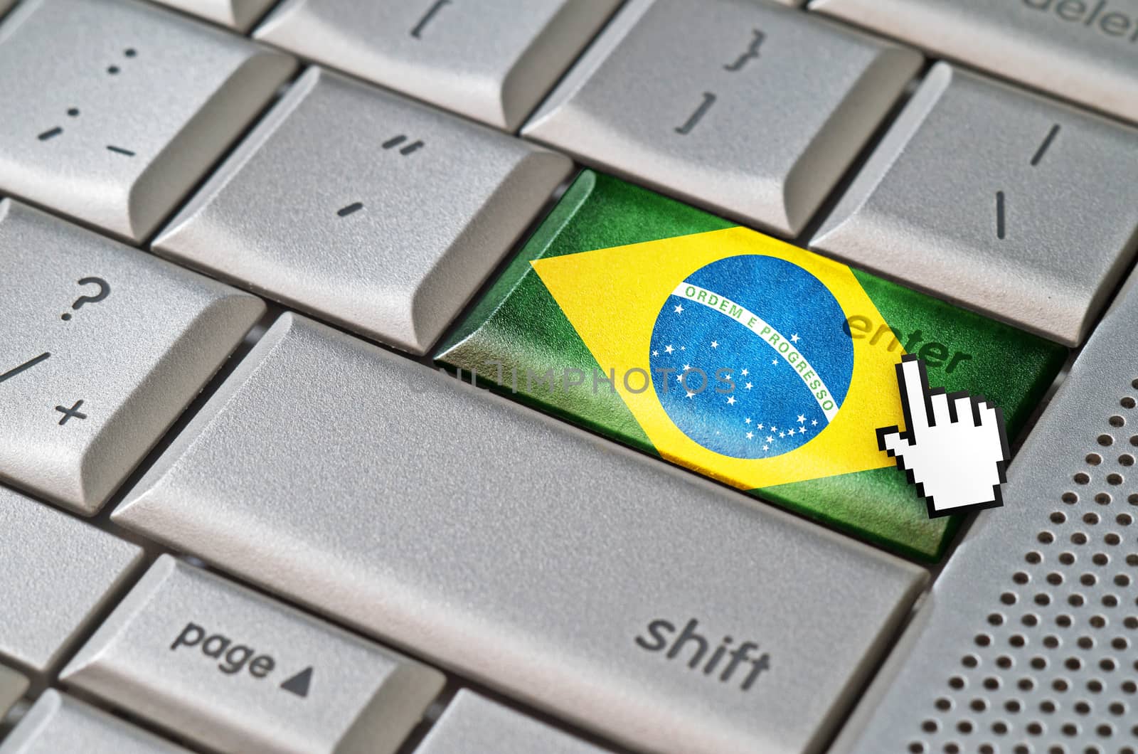 Business concept mouse cursor pressing Brazil enter key on metallic keyboard