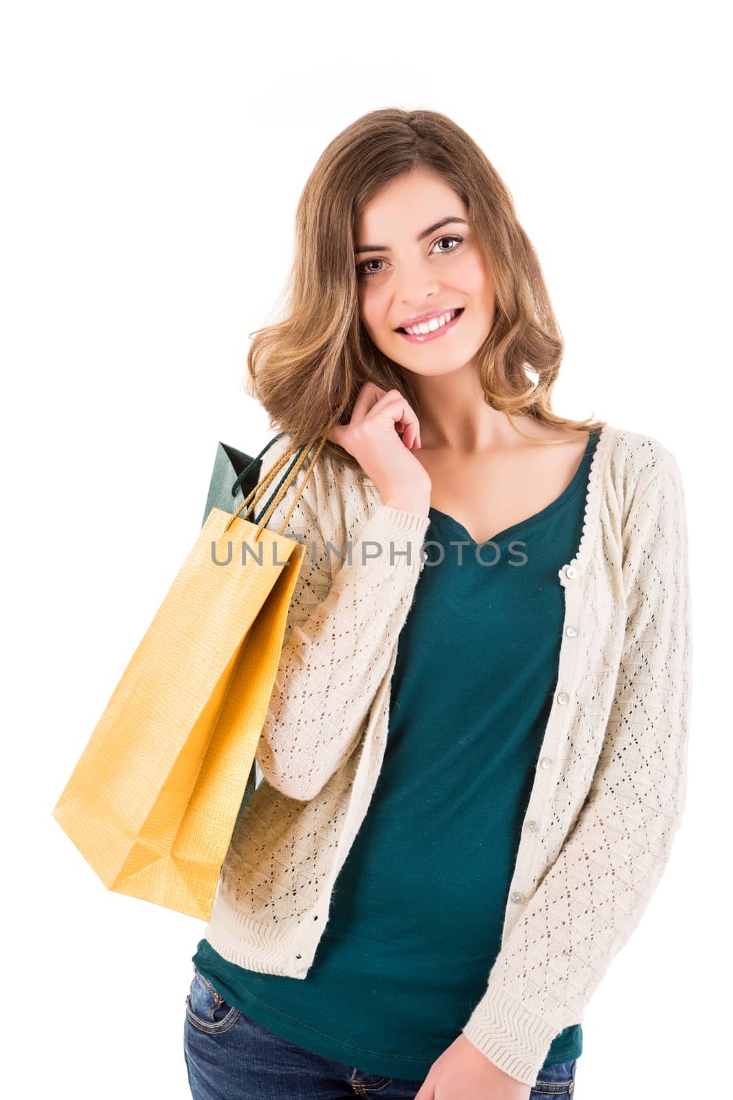 Beautiful woman holding shopping bags over white backgroung