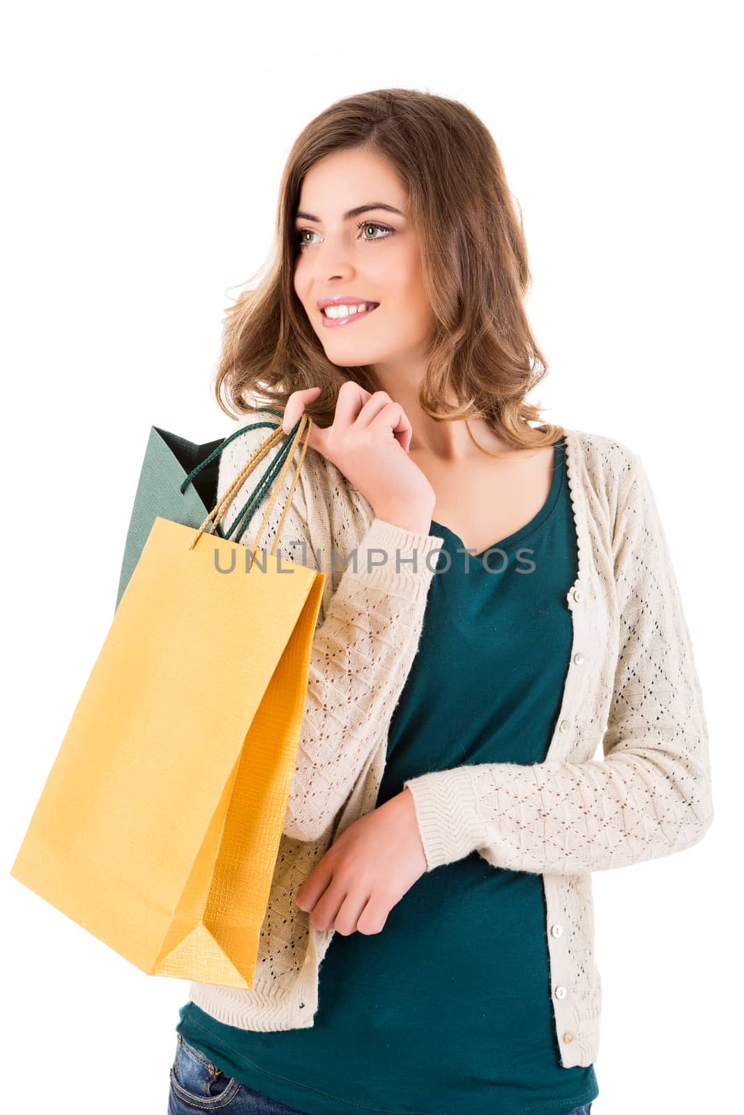 Beautiful woman holding shopping bags over white backgroung