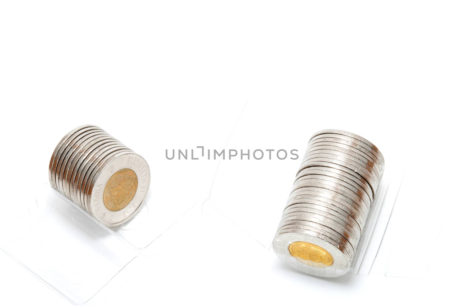 Plastic roll holding two dollar coins by daoleduc