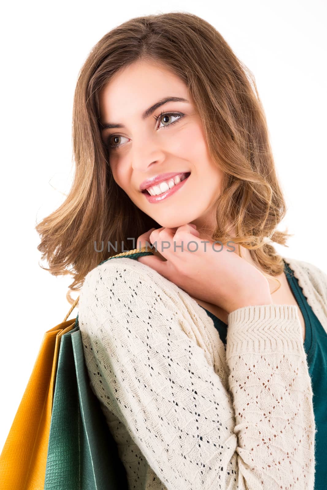 Beautiful woman holding shopping bags over white backgroung