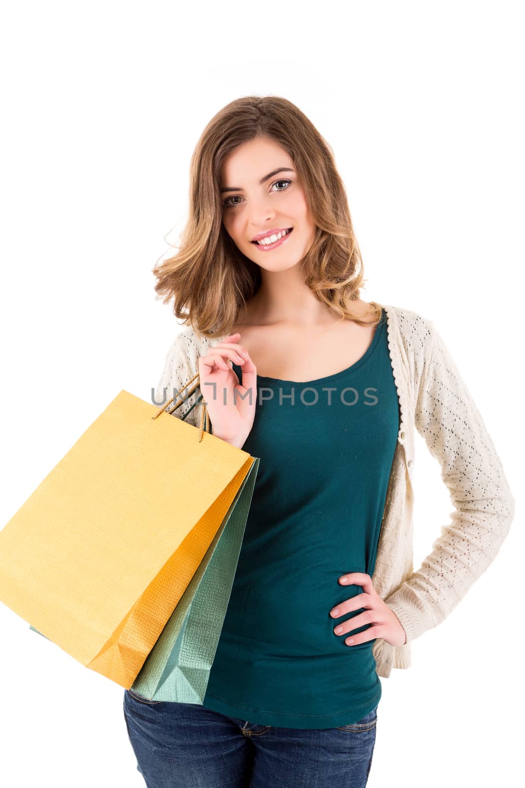 Beautiful woman holding shopping bags over white backgroung