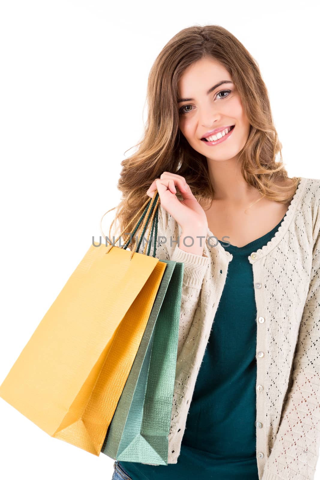 Beautiful woman holding shopping bags over white backgroung