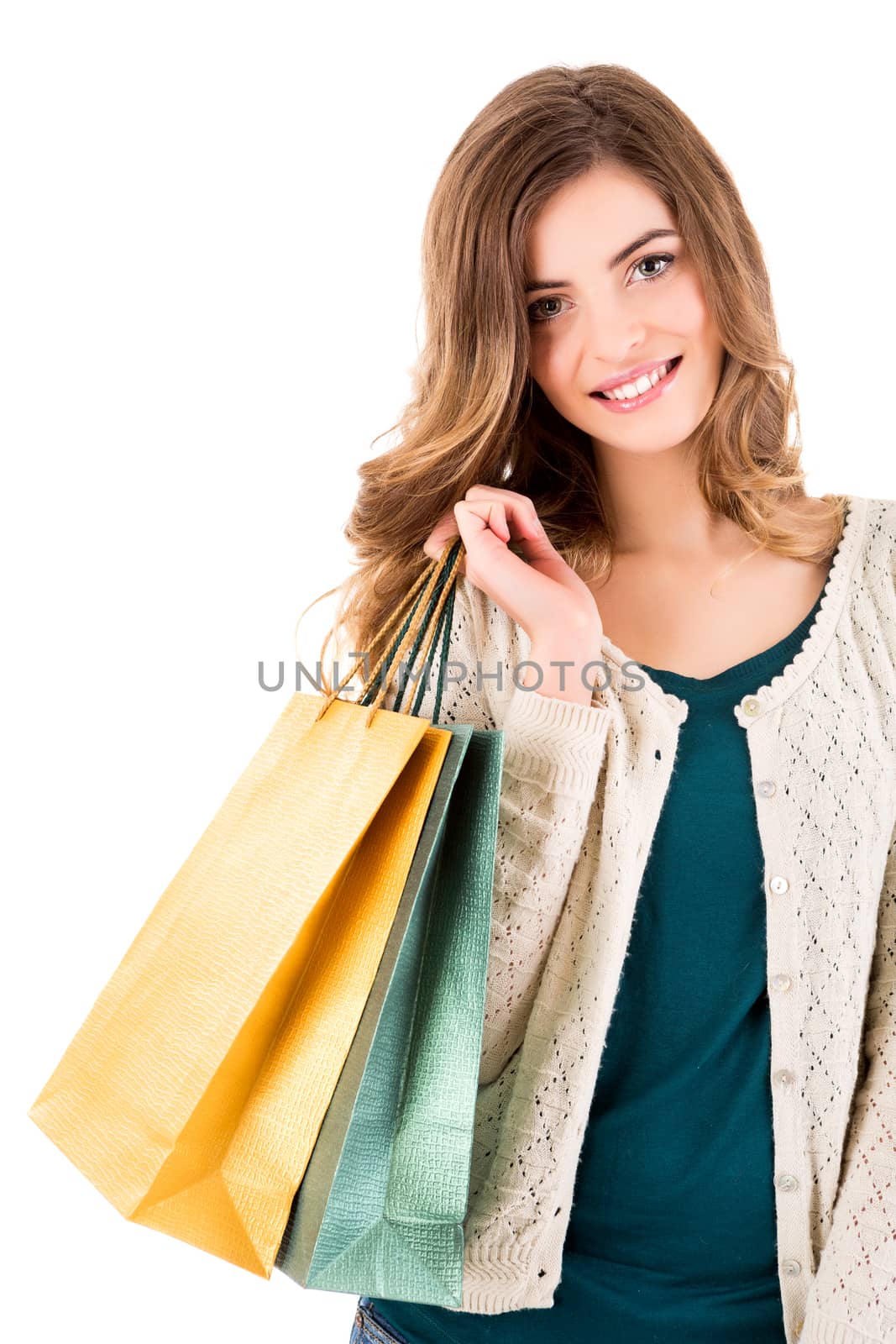 Beautiful woman holding shopping bags over white backgroung