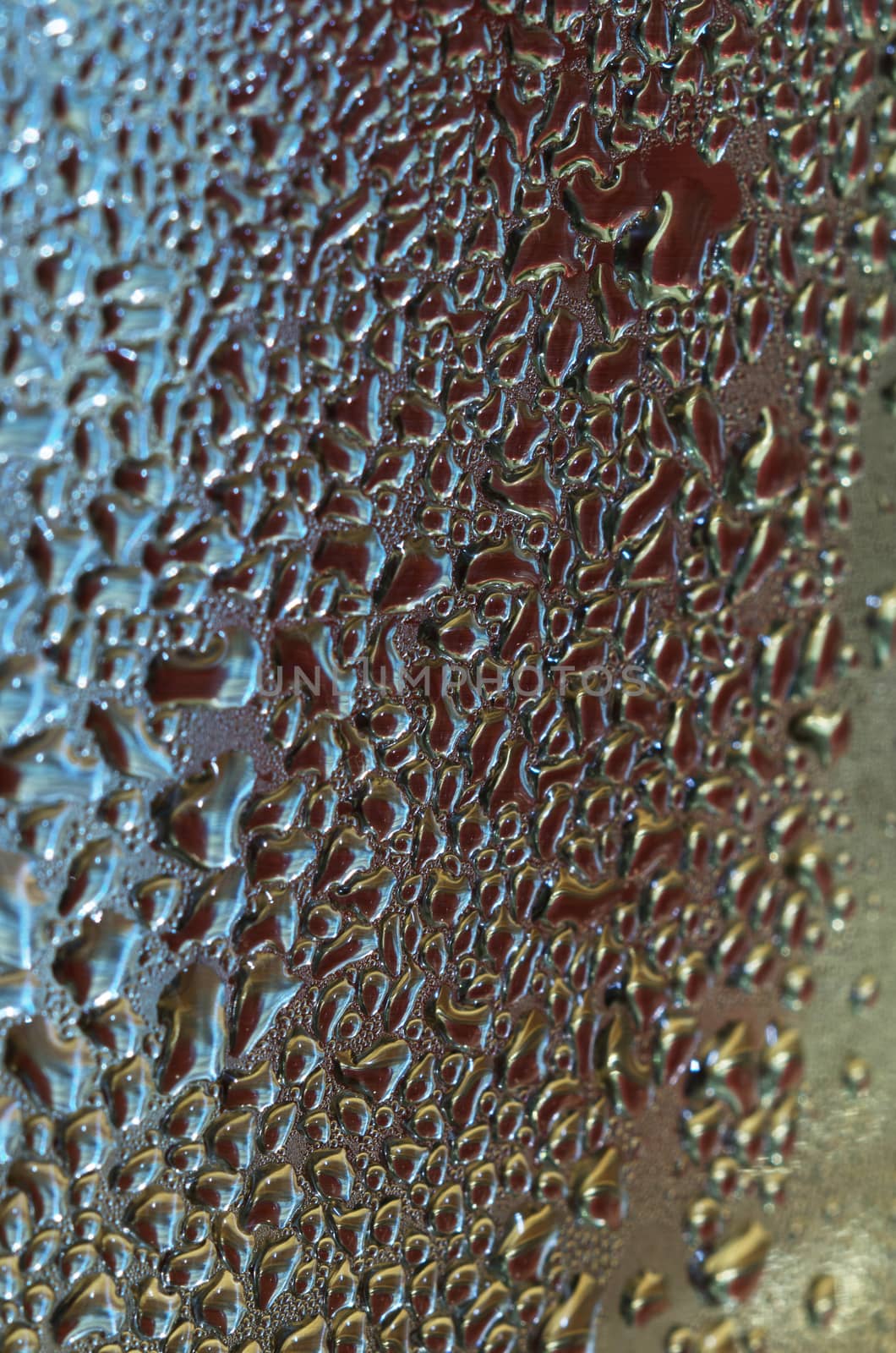 Water drops on metallic surface with color REFLECTION