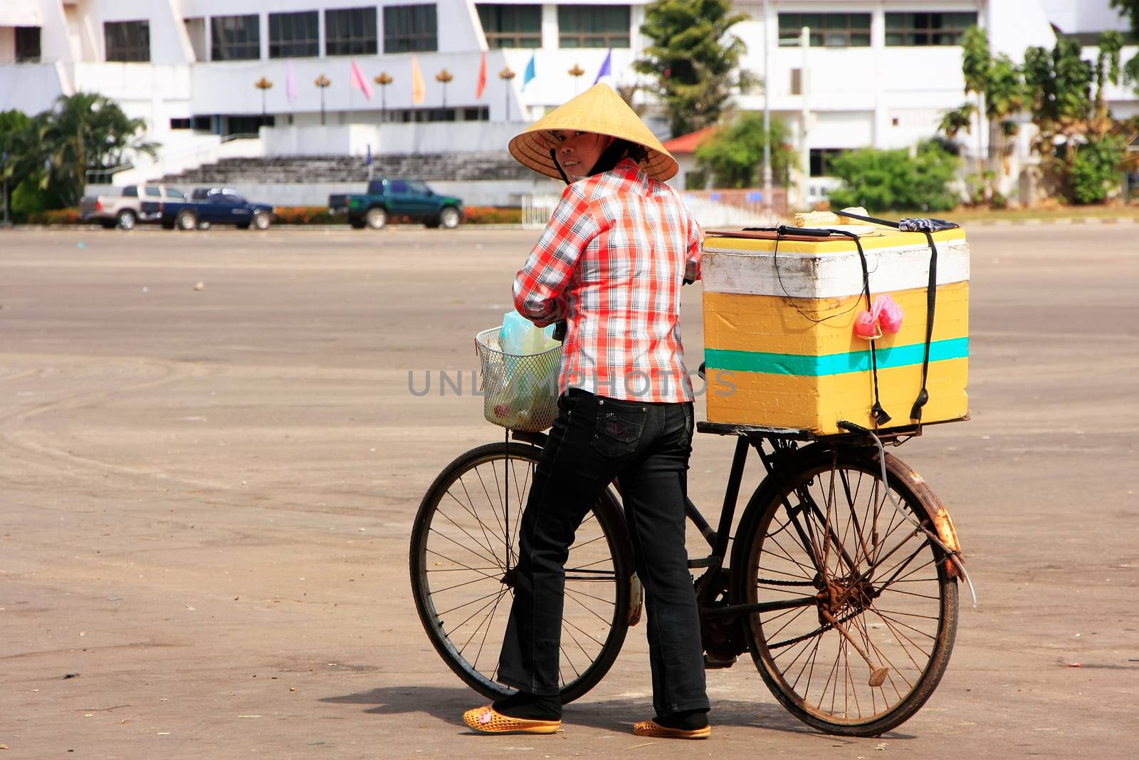 Local woman selling ice cream on the street, Vientiane, Laos, Southeast Asia