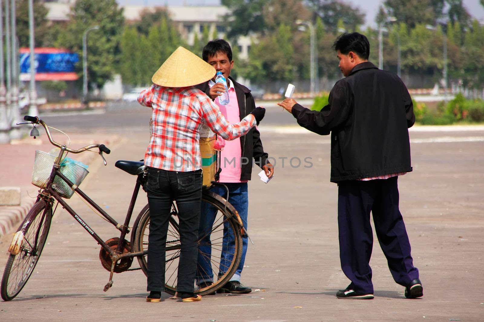 Local woman selling ice cream on the street, Vientiane, Laos, Southeast Asia