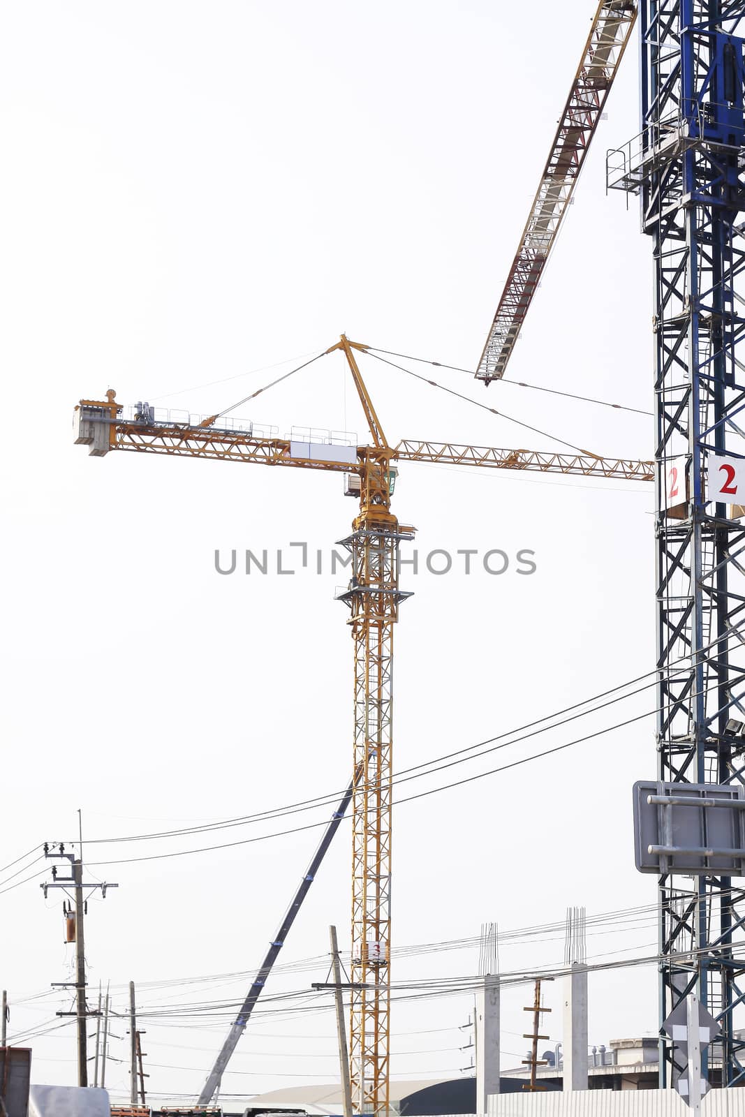 Construction site with tower crane and building