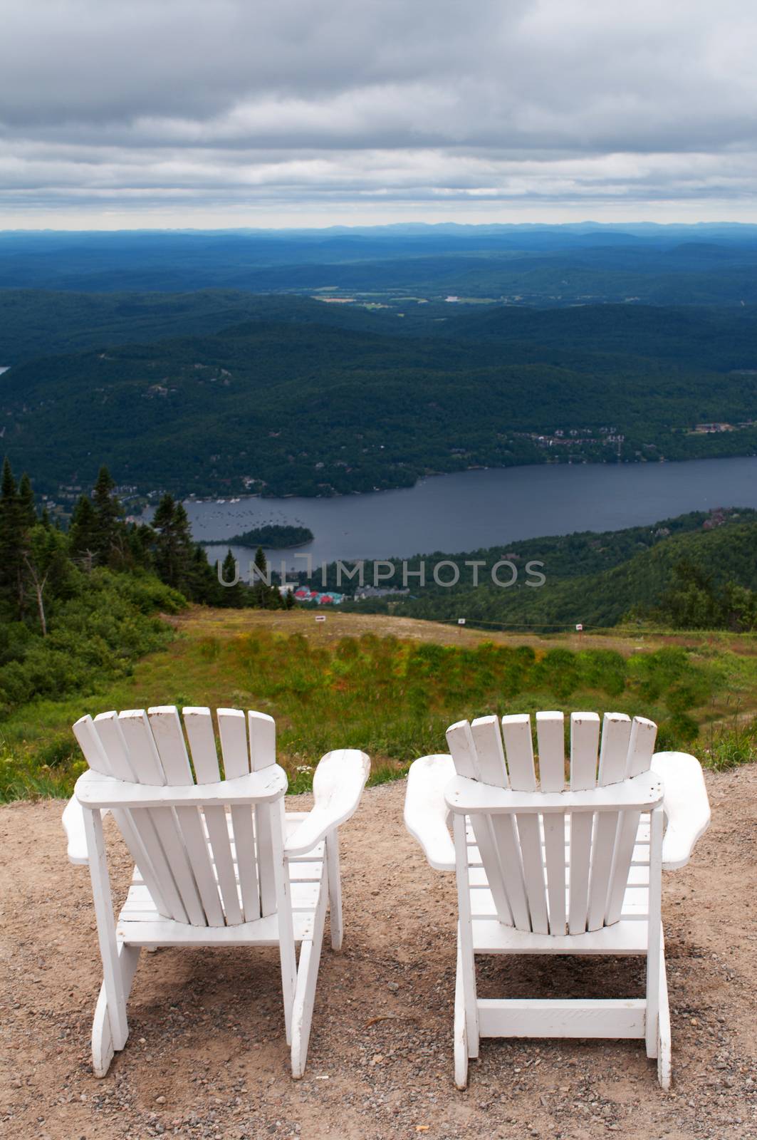 Chairs on top of mountain  at a ski resort by daoleduc