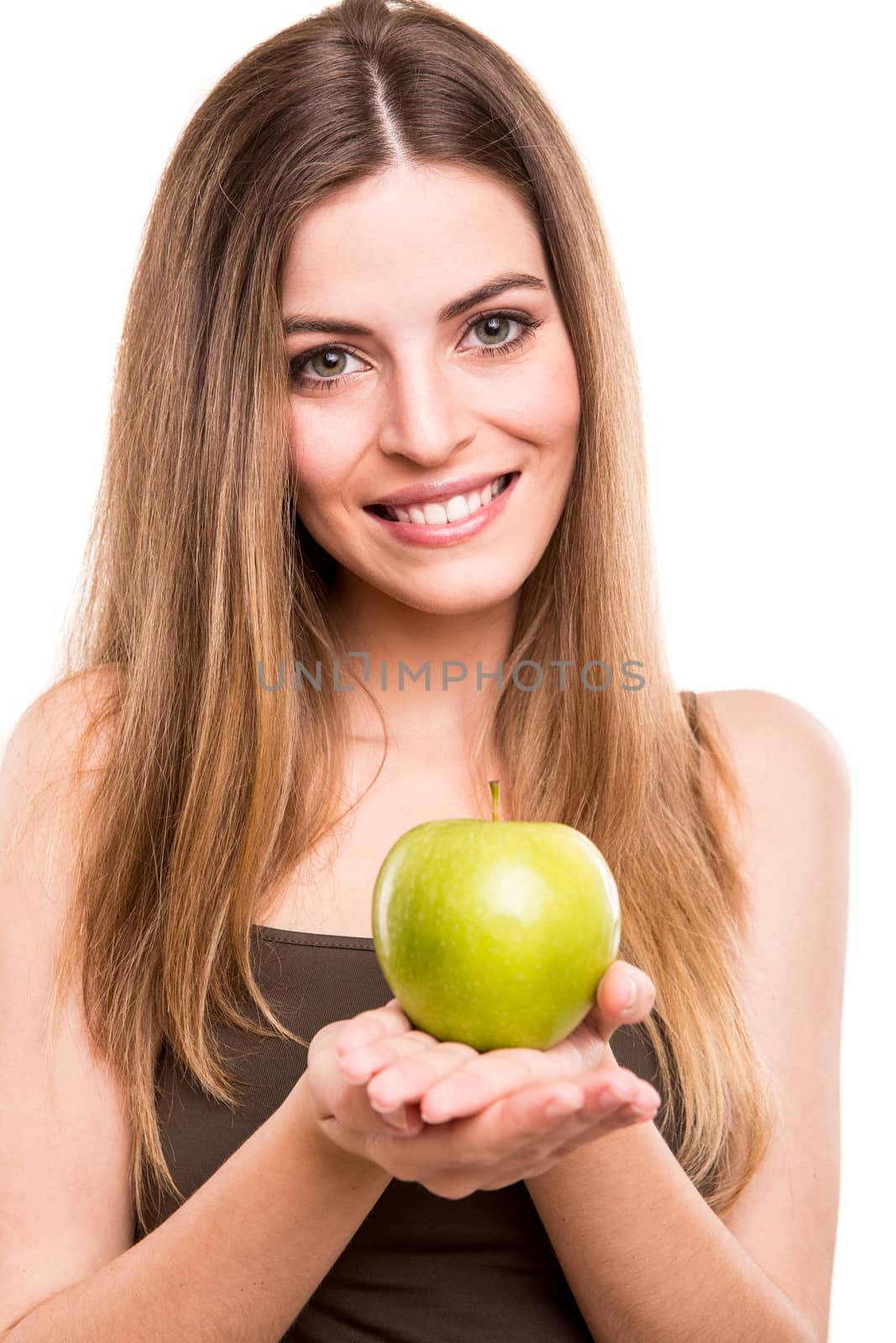 Portrait of a young woman eating green apple by jolopes