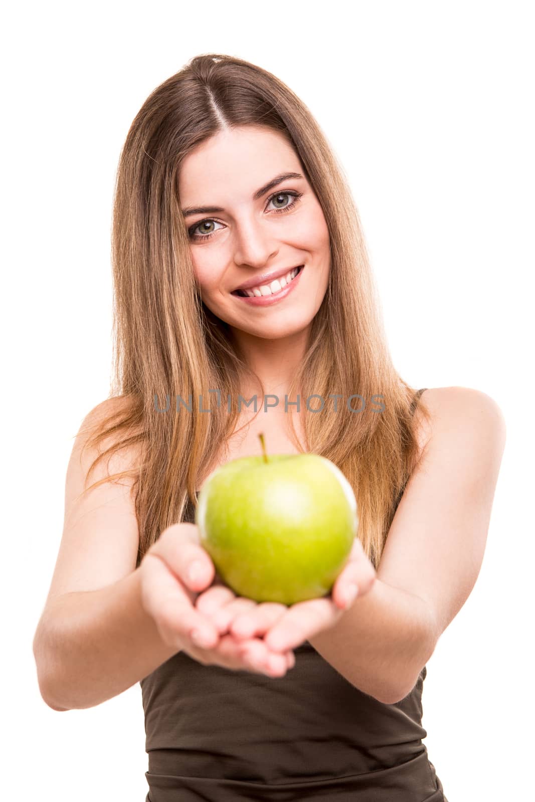 Portrait of a young woman eating green apple