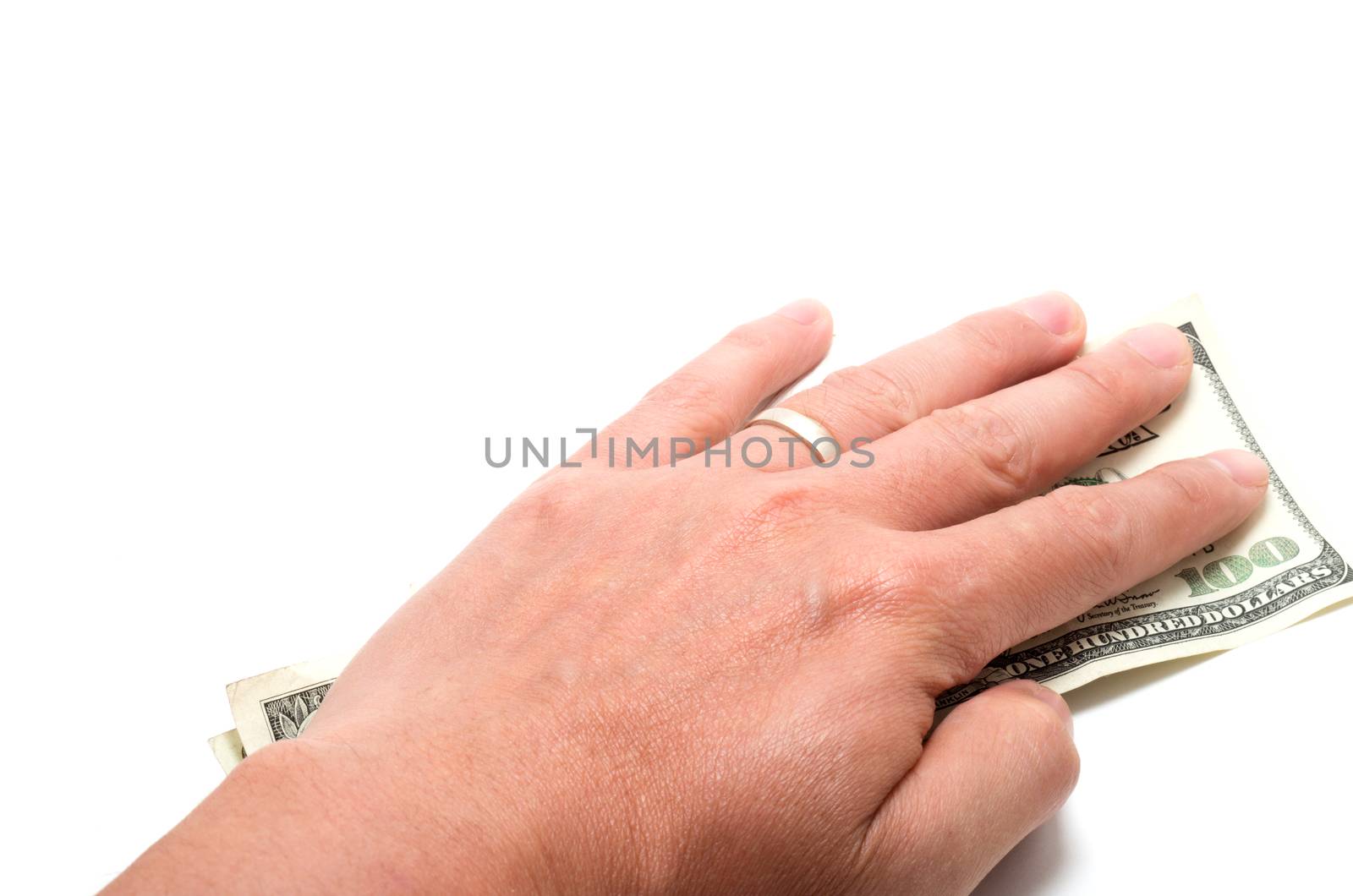 Hand hiding the stash of American banknotes on white background