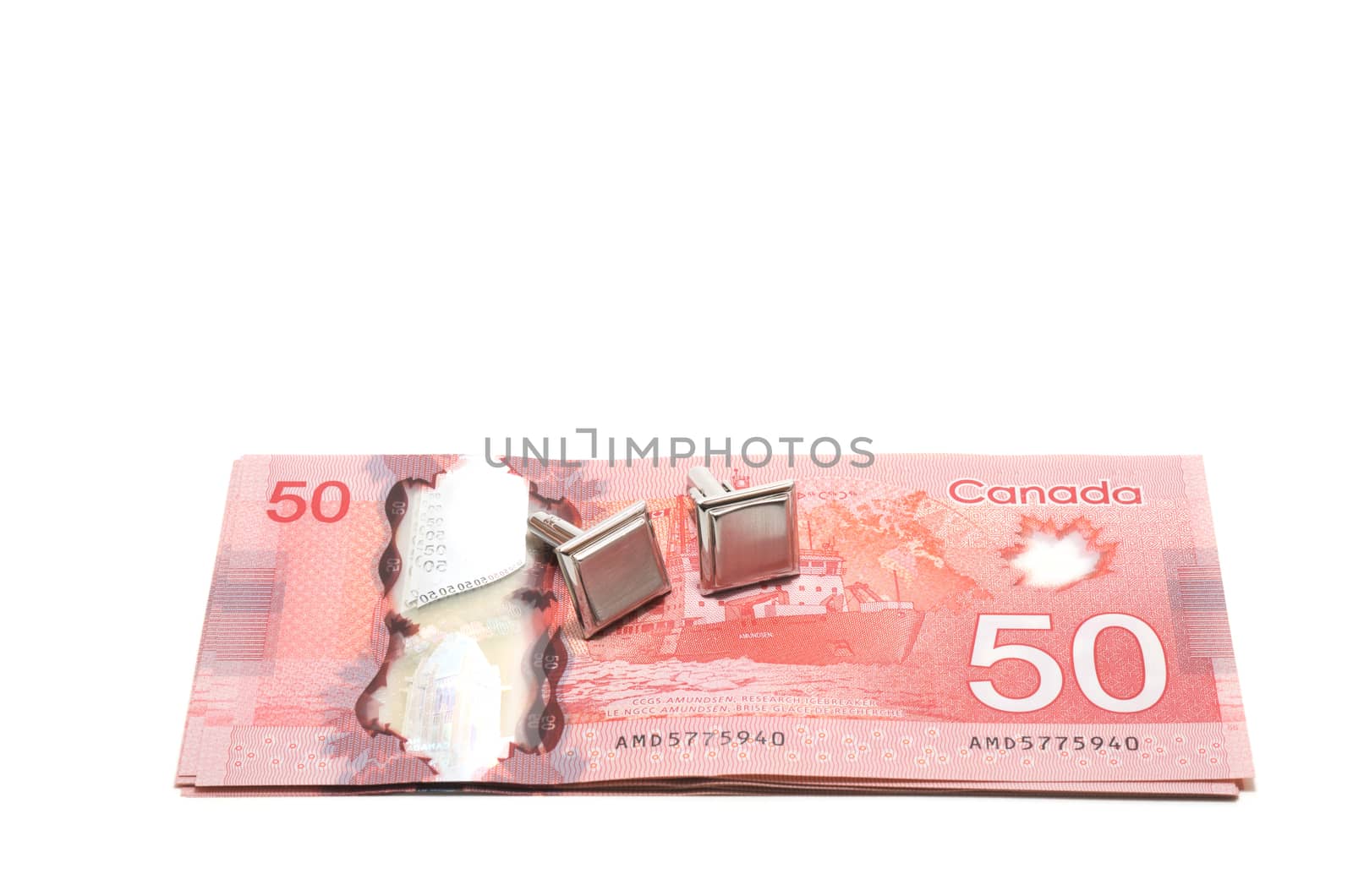 Selective focus of a series of 50 Canadian dollars on white back by daoleduc