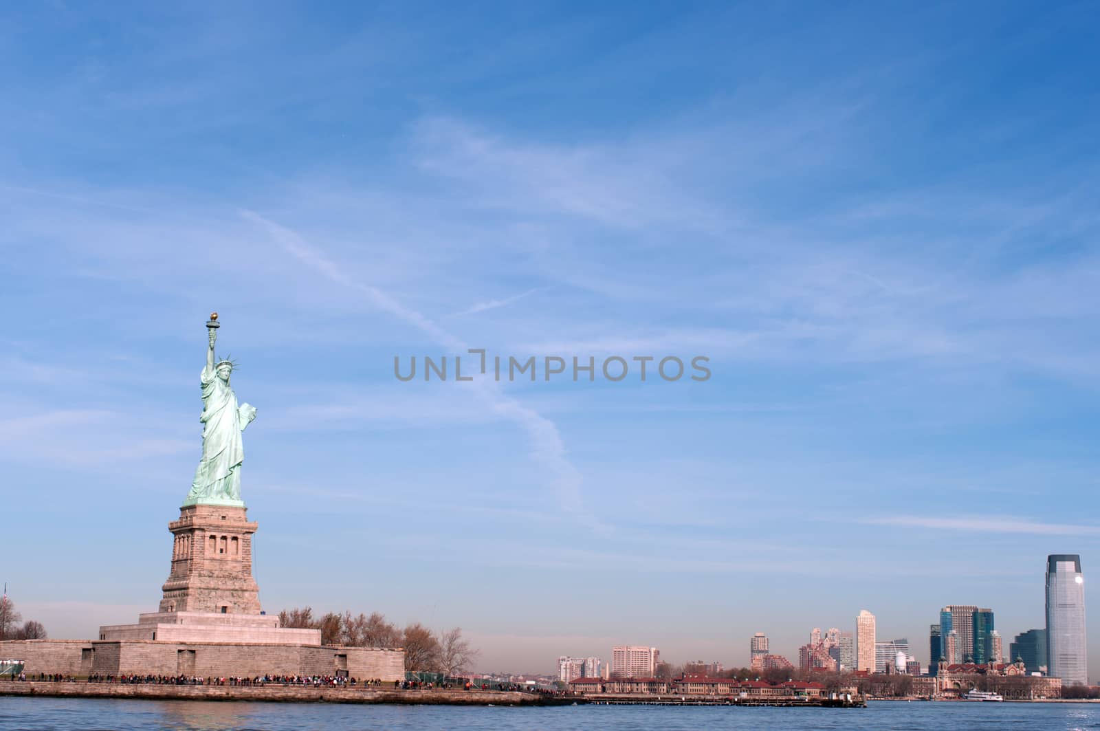 Liberty statue in Manhattan, NY, USA during a sunny day