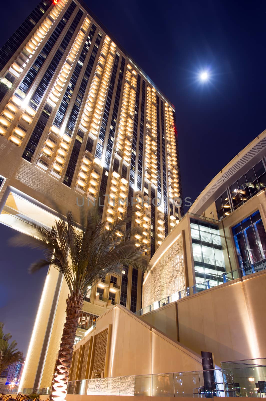 Dubai Marina at night with full moon