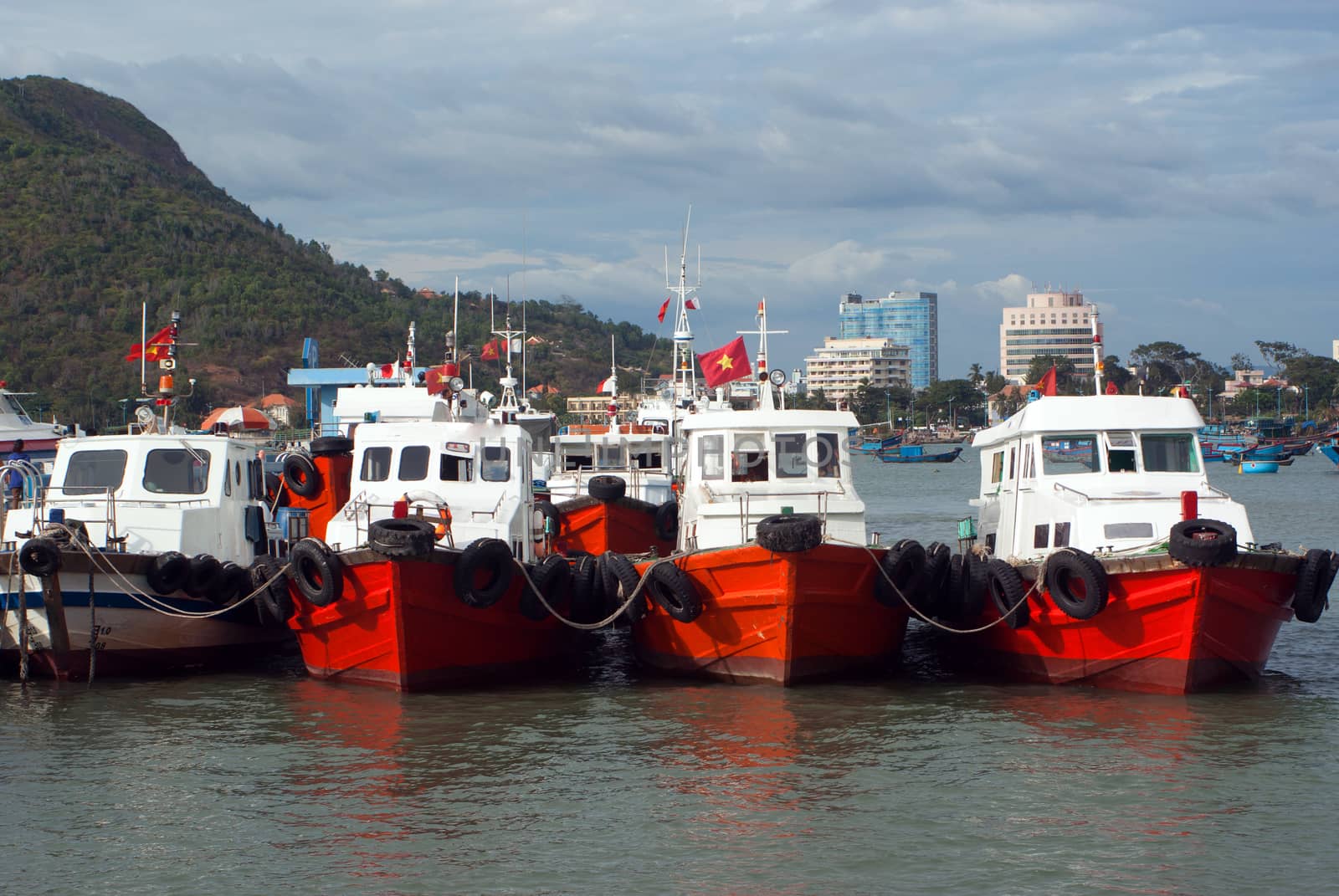 Fishing boats lined up at a dock in Vung Tau, Vietnam, Asia