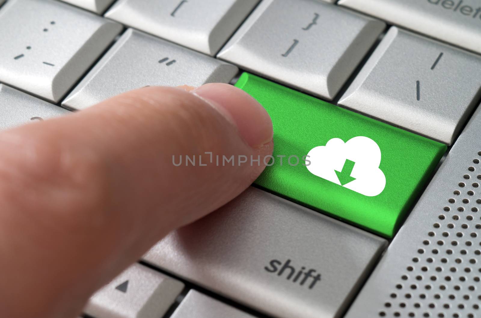 Business concept male finger pointing download from cloud key on  a metallic keyboard