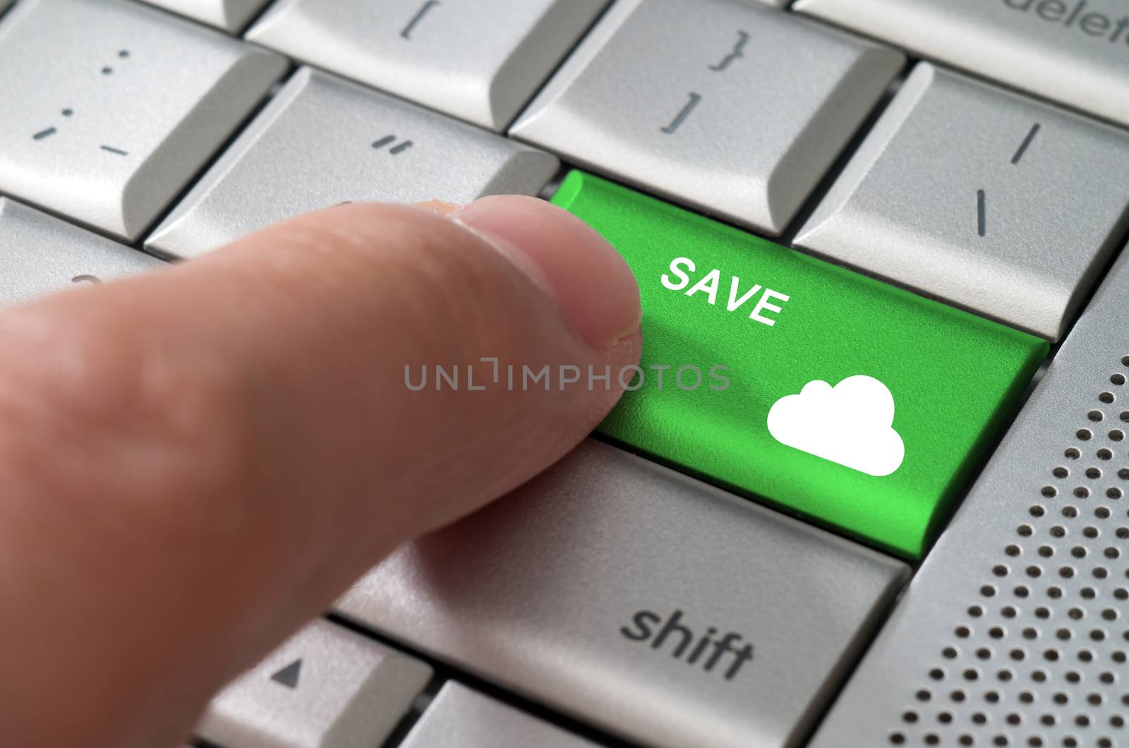 Business concept male finger pointing save to cloud key on  a metallic keyboard