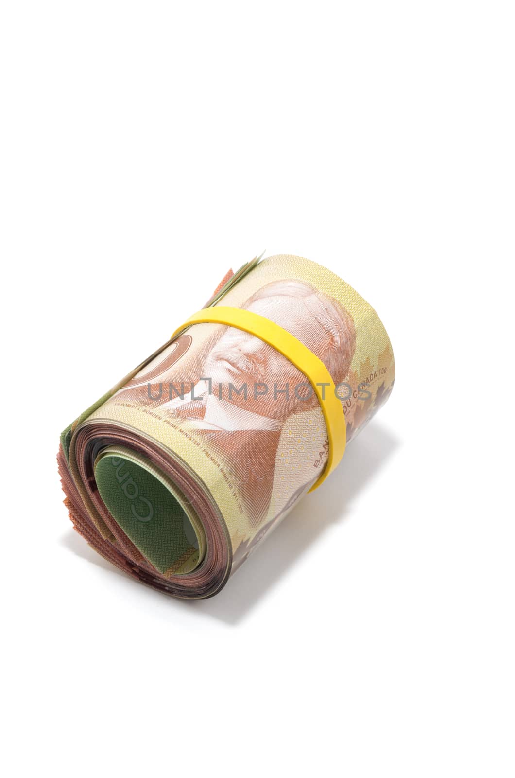 Roll of Canadian banknotes with 100 dollars at the surface by daoleduc