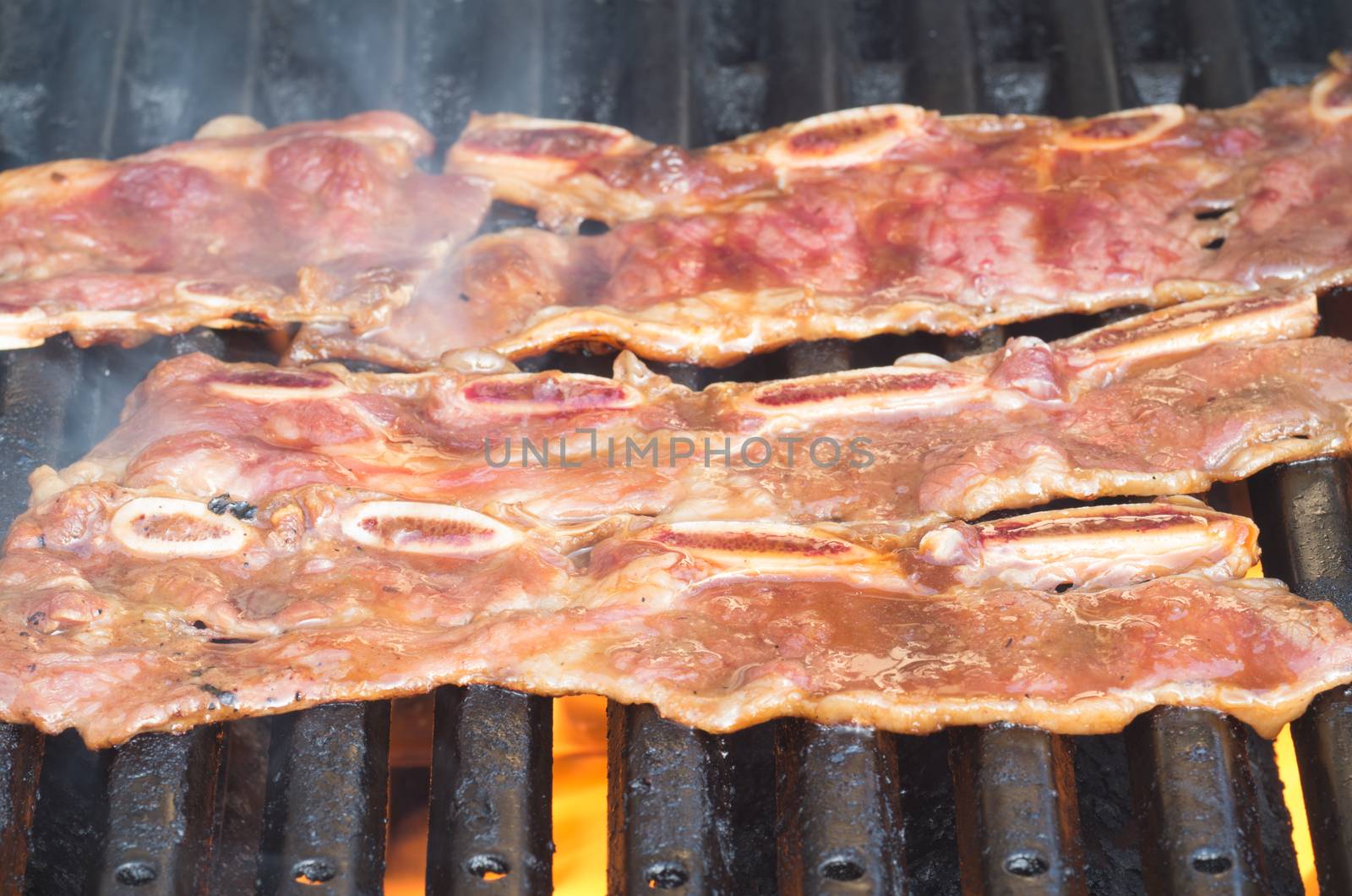 Korean short ribs grilled on a barbecue