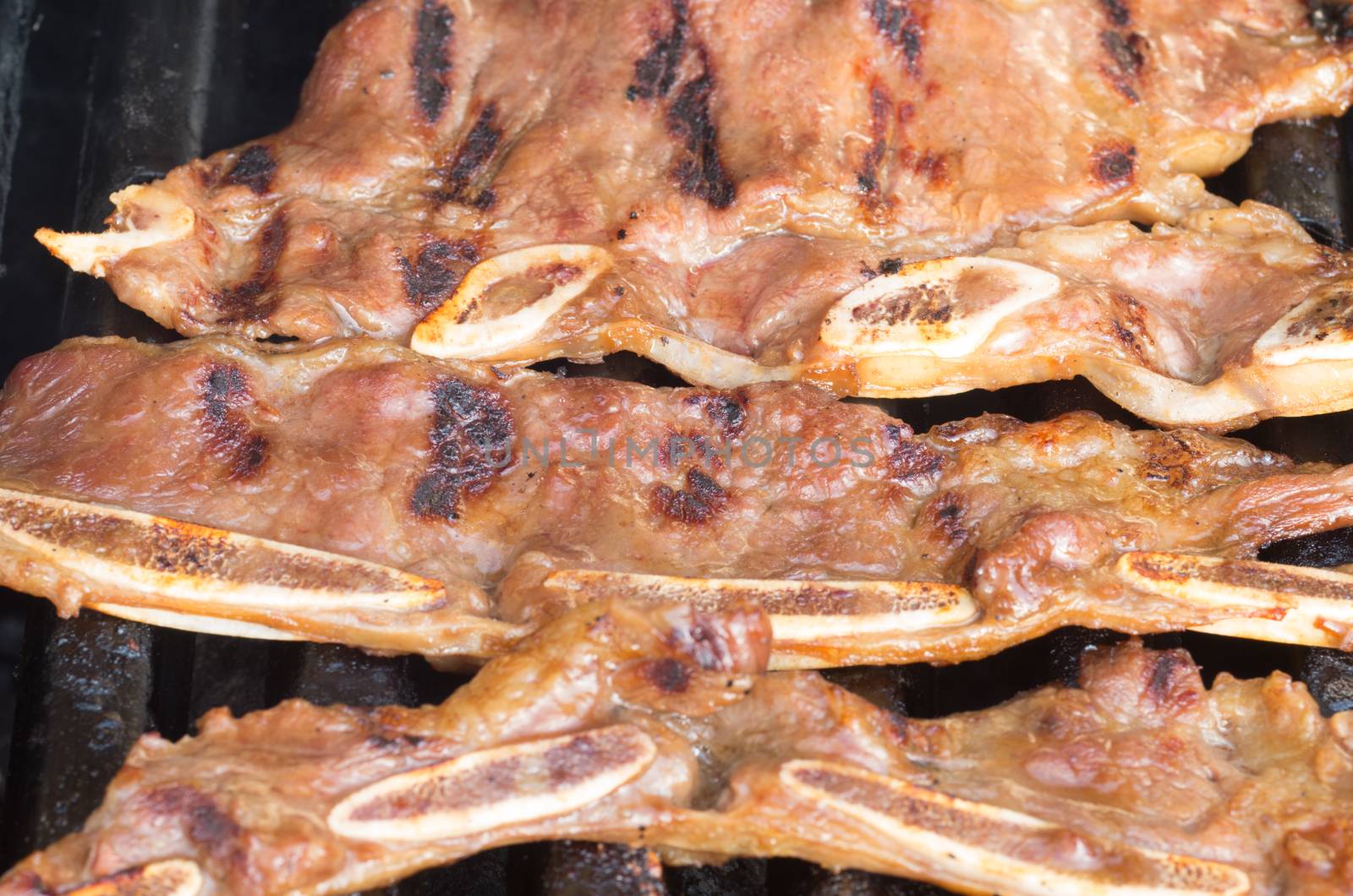 Korean short ribs grilled on a barbecue