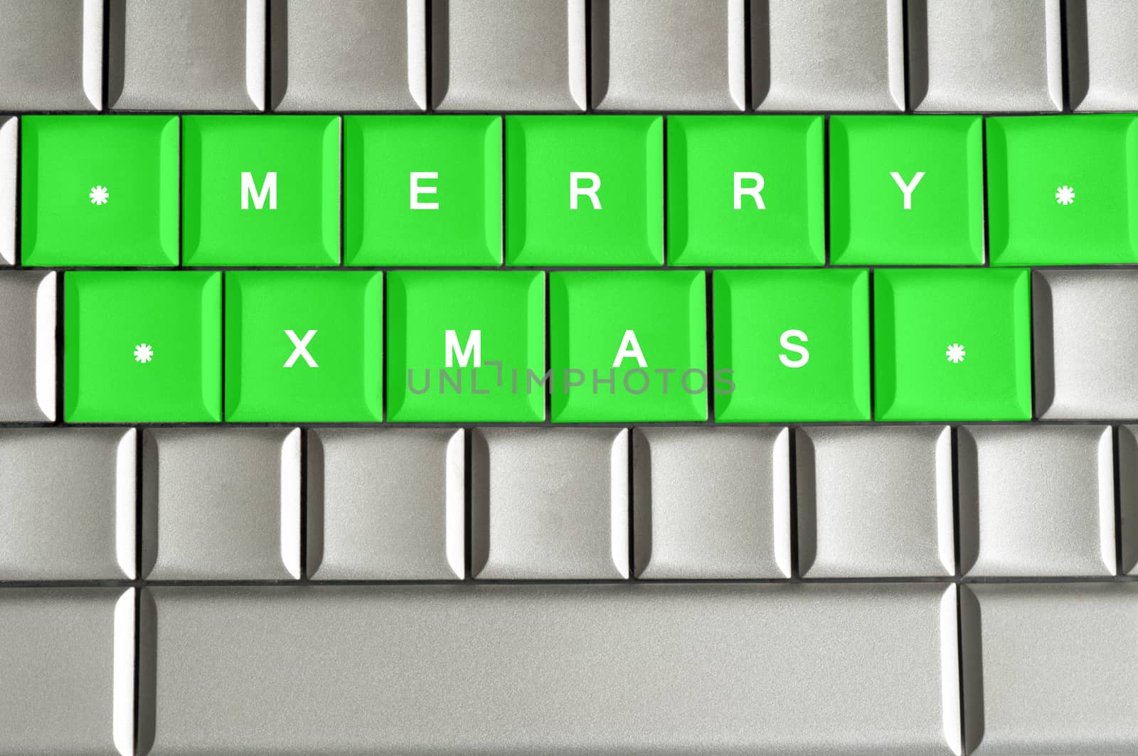Merry Xmas spelled on a silver metallic keyboard