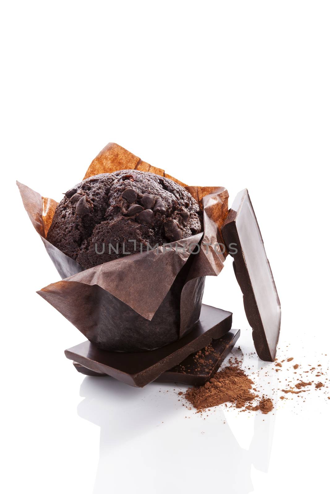 Chocolate muffin with chocolate and cocoa powder isolated on white background. Culinary sweet dessert. 