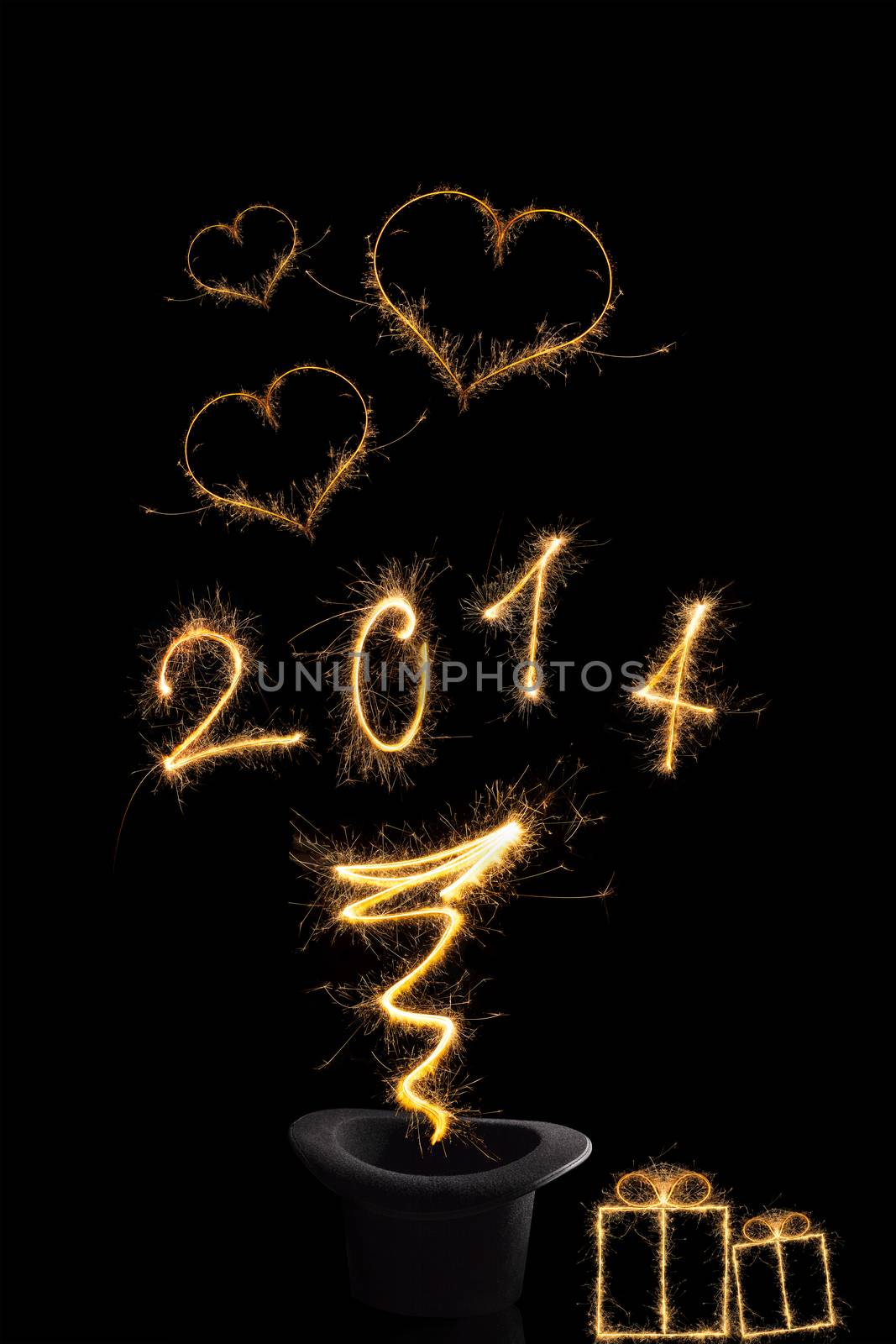 Magical new year. Magical fireworks from black top hat forming 2014 and abstract light lines isolated on black background. Happy new year background.